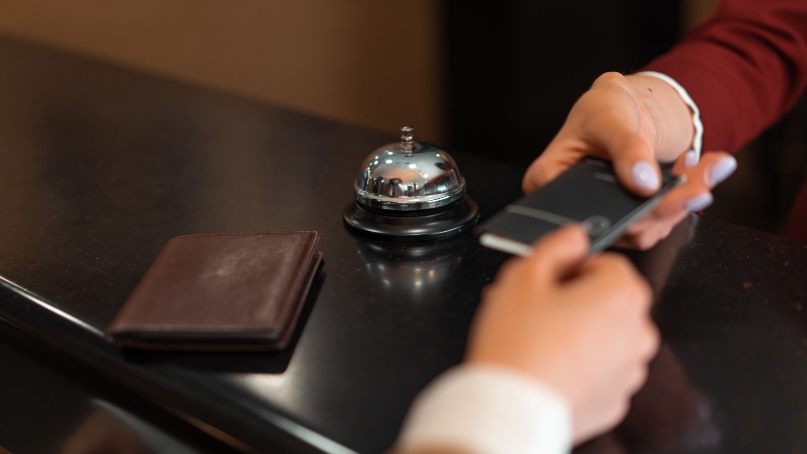 They Got Their Dream Hotel Spot, But They Had No Idea What They Were Actually Signing Up For a hotel guest being handed a key card