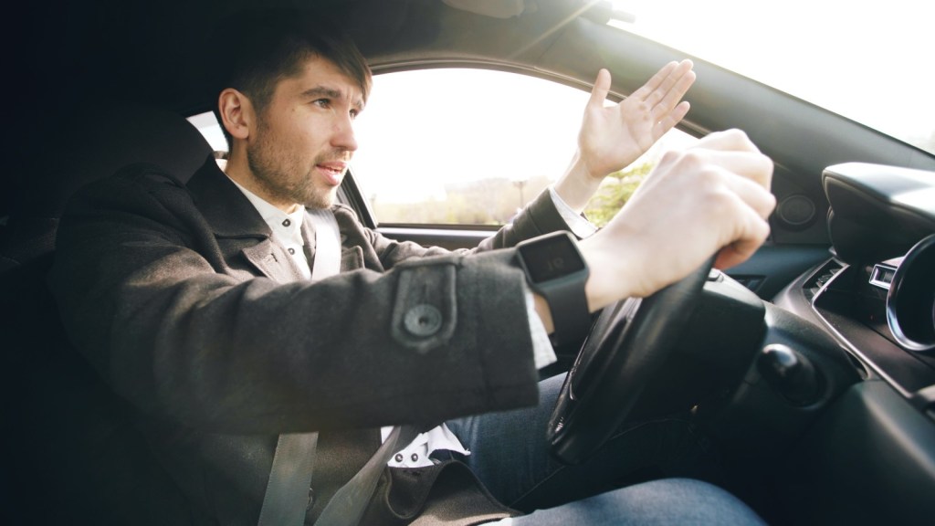 a frustrated man driving