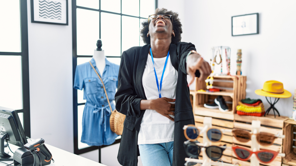 retail store employee laughing hysterically