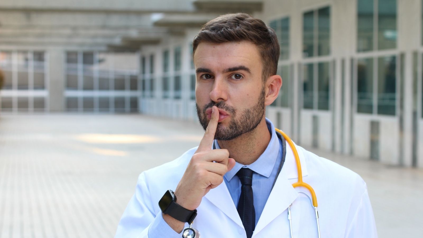 doctor making shushing motion