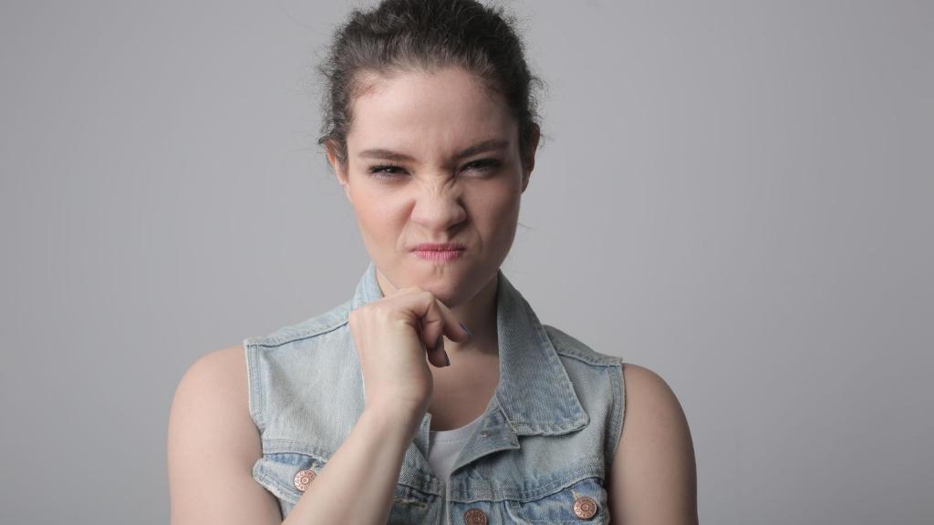 rude woman scrunching her face