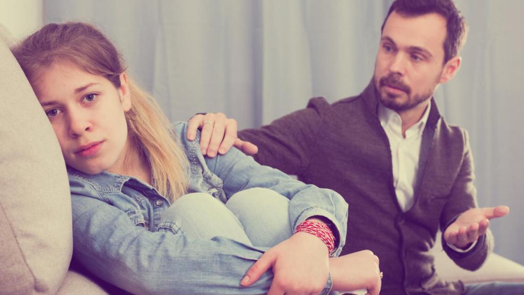 man talking to his daughter