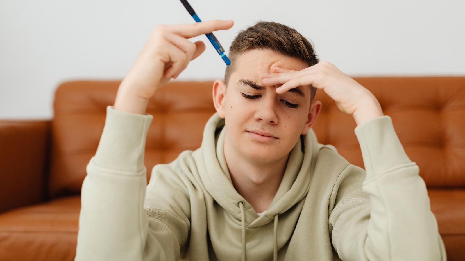 stressed male college student