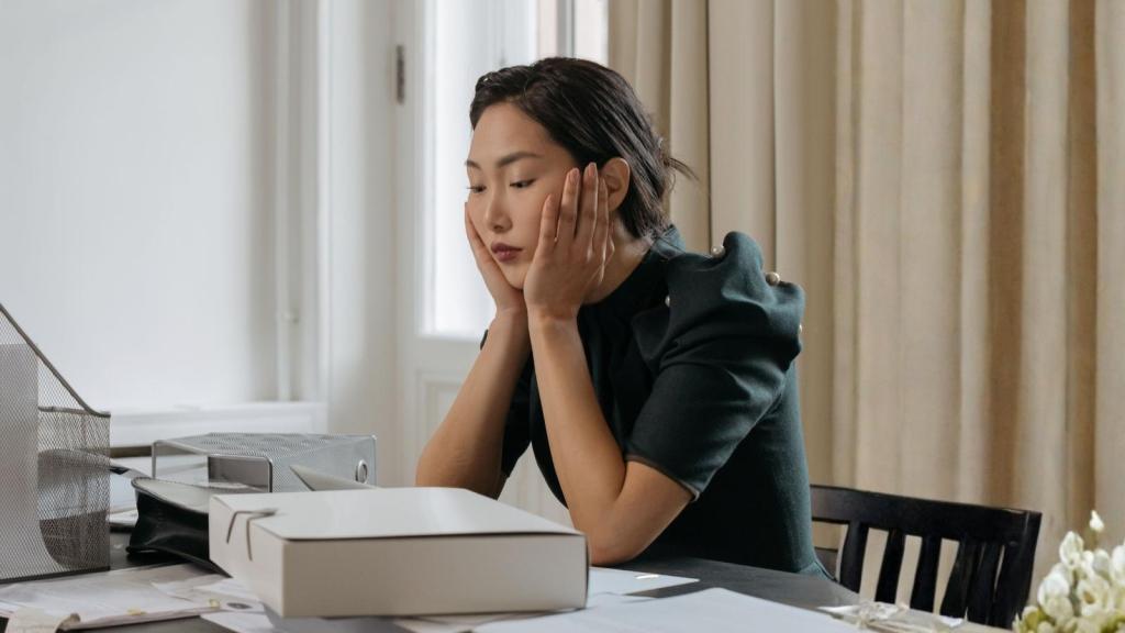 stressed woman at her desk