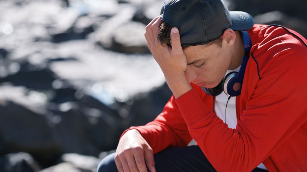 teen boy angry on vacation