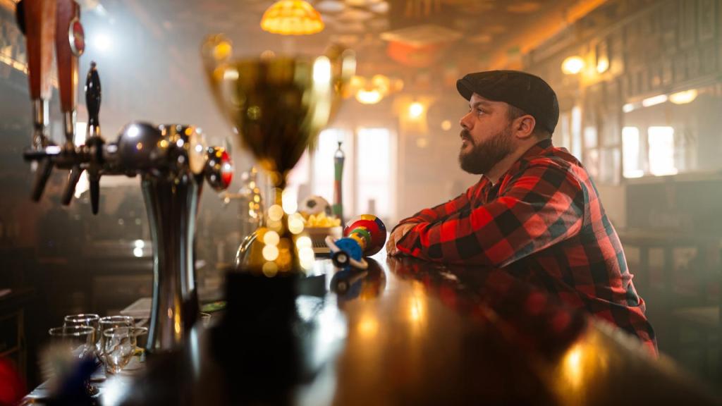 man sitting at a bar