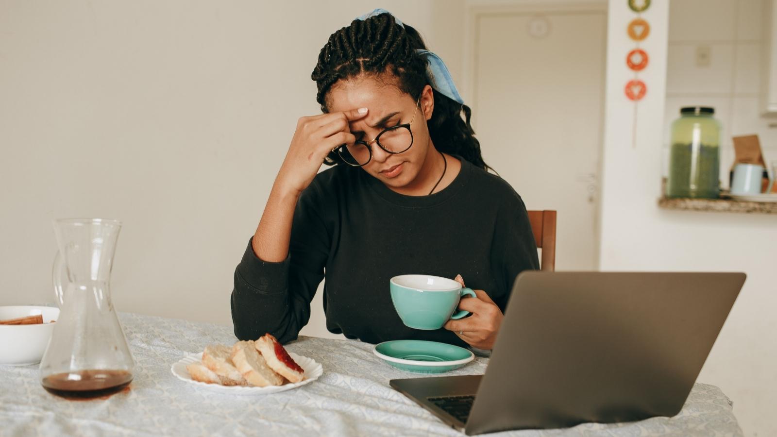 Woman Refuses to Give Brother Access to Her Investment Account, but Her Mother Says She’s the Problem troubled woman by her computer