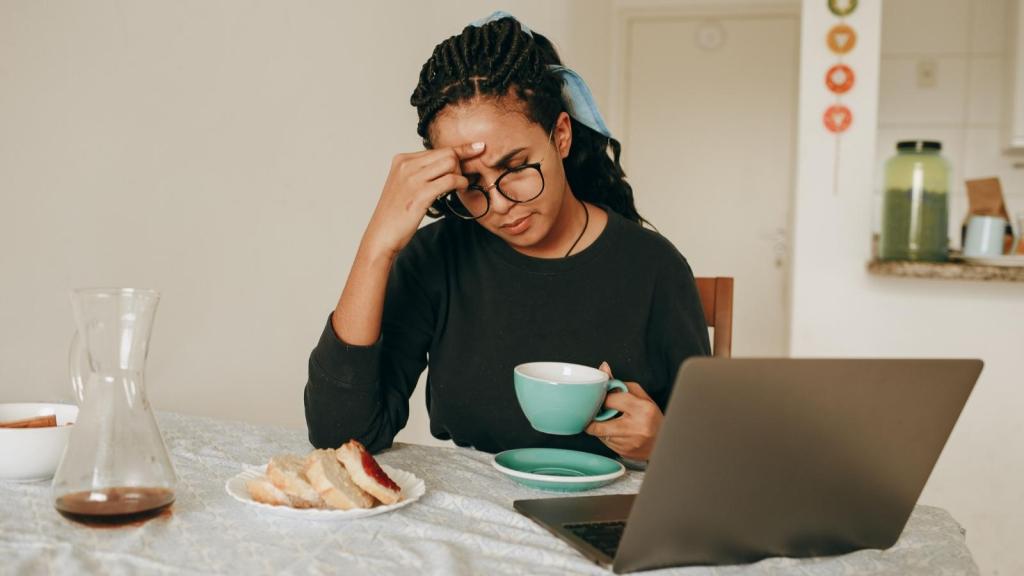 troubled woman by her computer