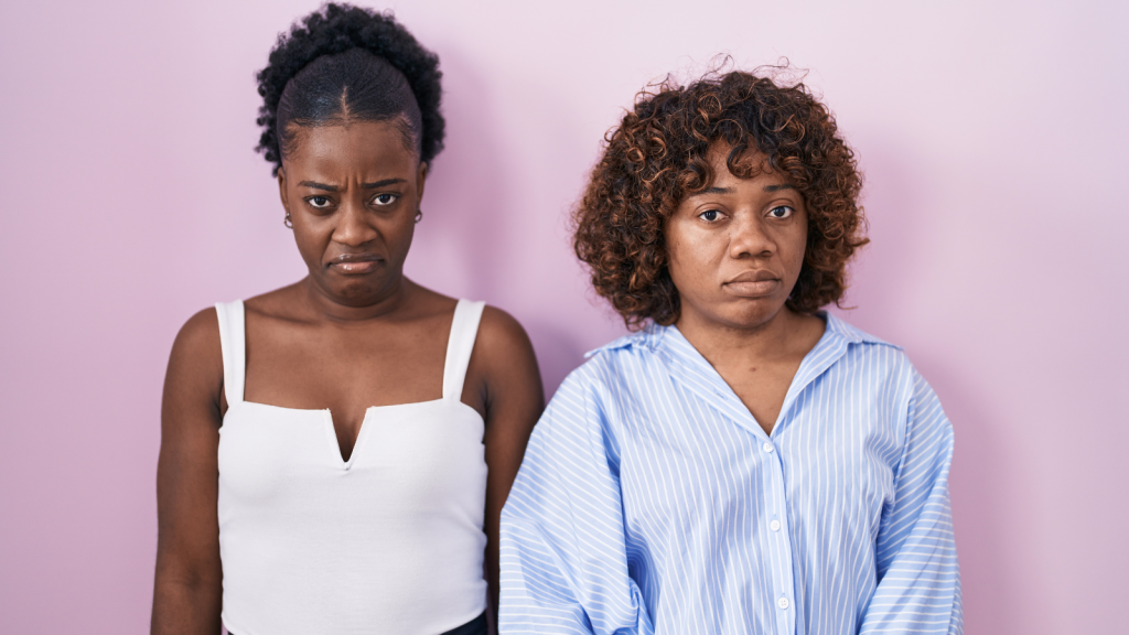 two african american young women unsure