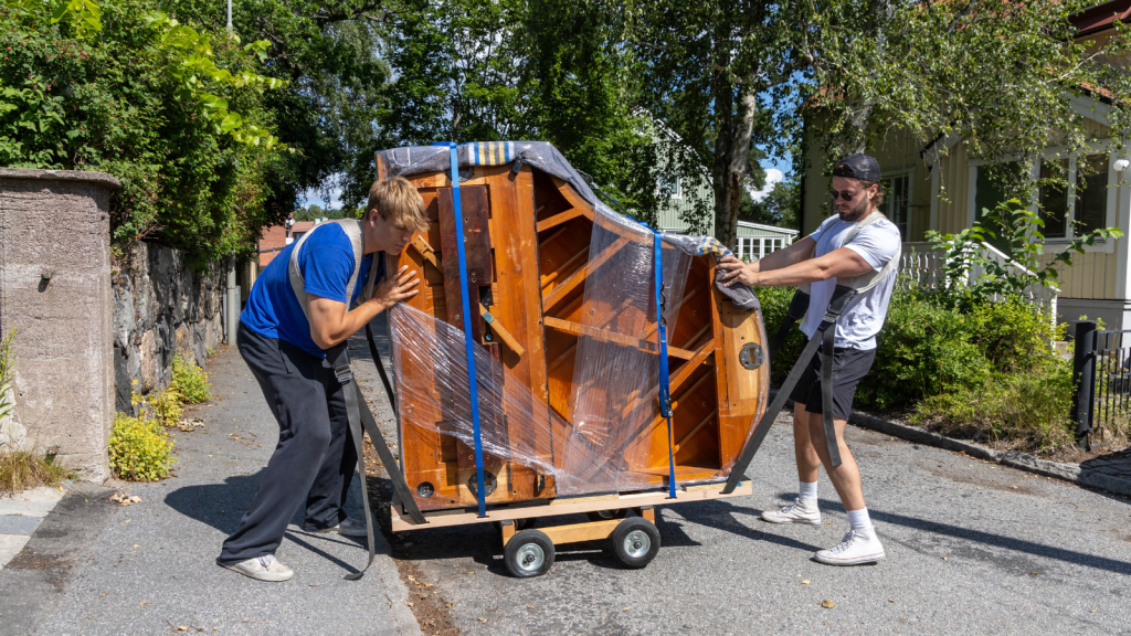 They Thought They Were Just Attending A Party, But The Evening Ended With An Unexpected Request To Lug A Massive Piano two men moving a piano