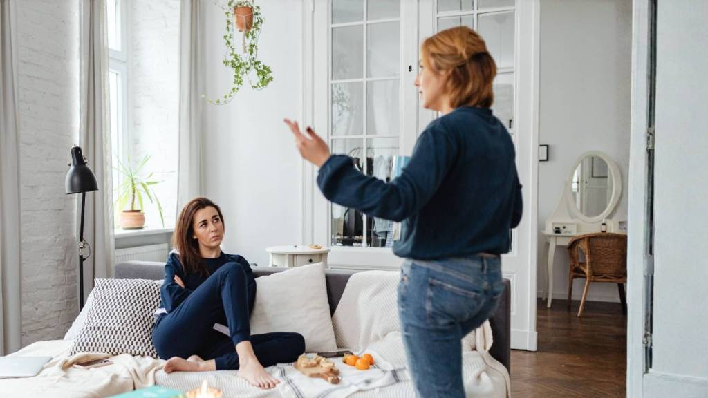two women arguing in living room