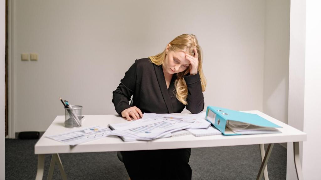 unhappy female employee at her desk
