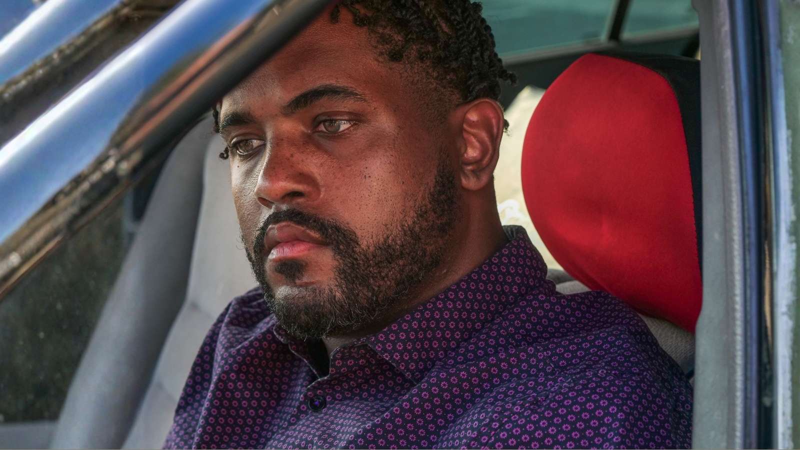 Their Company Slaughtered Four Years of Remote Work—Then handed Everyone a Monthly Parking Fee Just to Sit at a Desk upset man sitting in his car