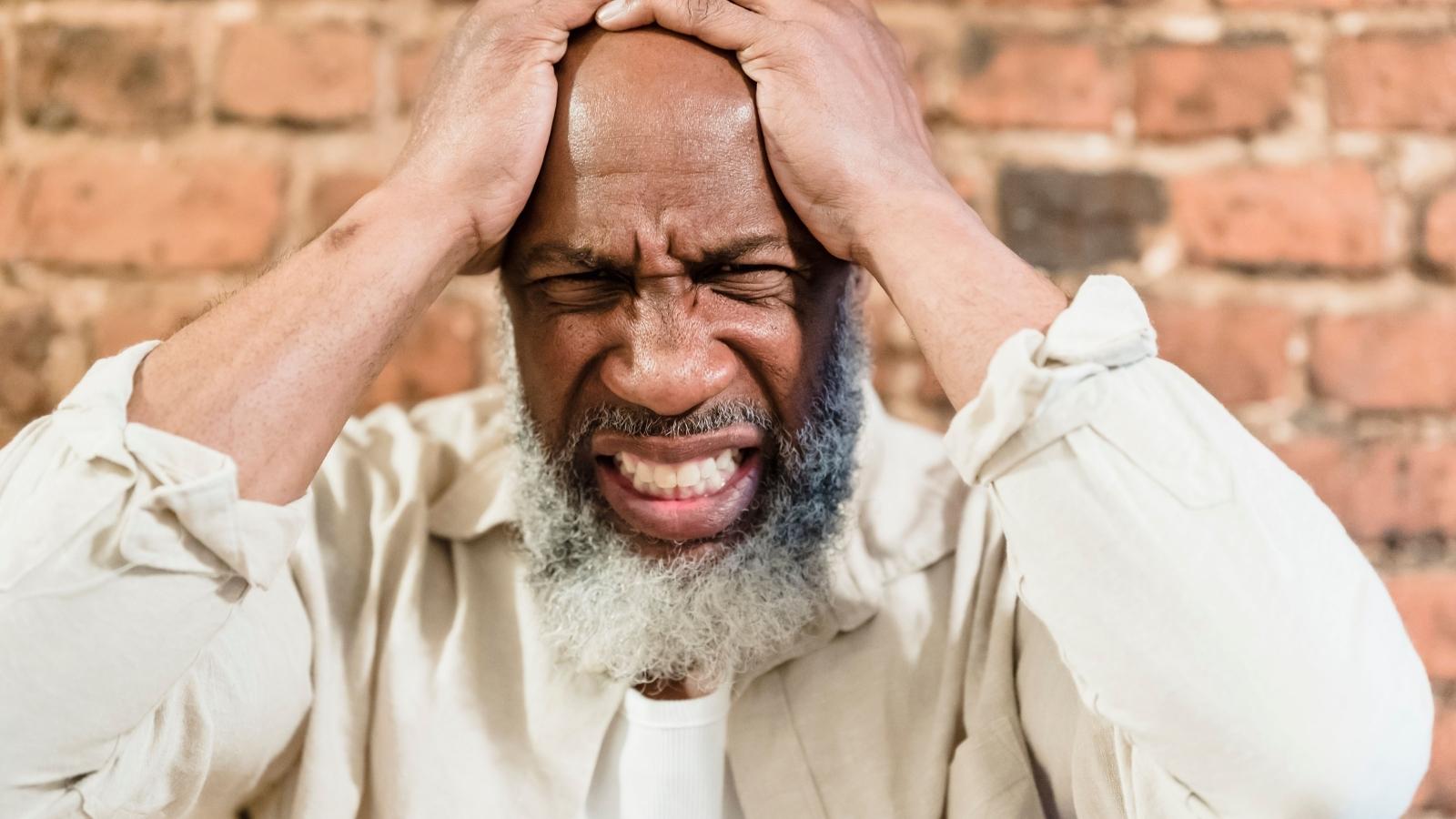 She Surprised Her Dad With His Long Lost Sibling for His Birthday—Then Watched the Reunion Turn Into a Nightmare upset older man looking troubled
