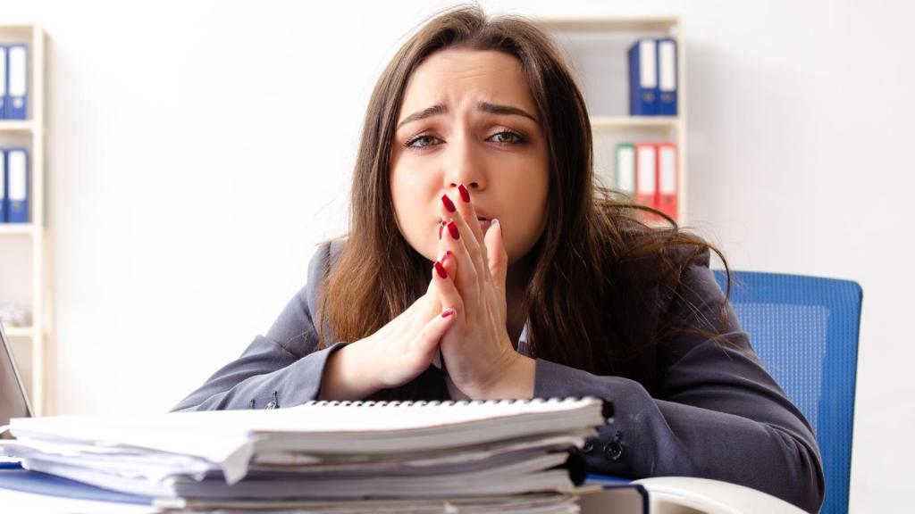 woman stressed at her desk
