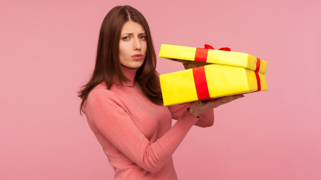 woman annoyed giving gifts