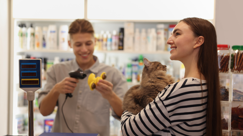 A Chaotic Pet Store Visit Ends With A Customer Demanding An Employee Be Fired, But She Has No Idea His Father Owns The Business woman buying toy for her cat in pet store