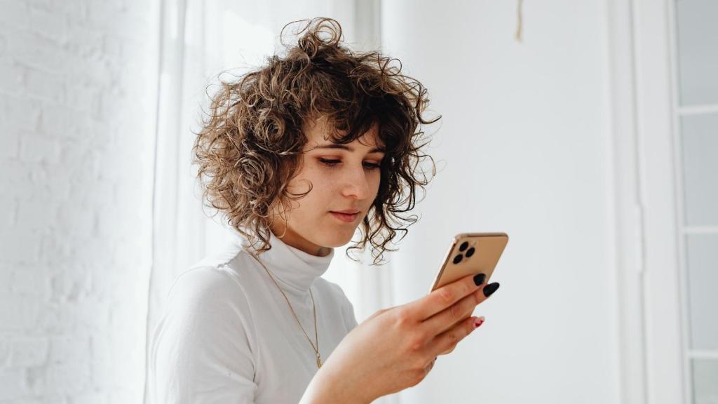 woman reading a text on her smartphone