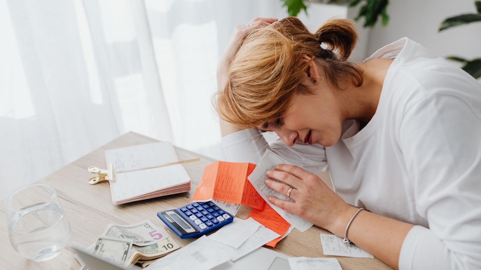Shes Owed Money by Three Friends Who Are All Struggling Financially — She Wants It Back and Doesnt Know if Shes Wrong to Ask woman stressed about her finances