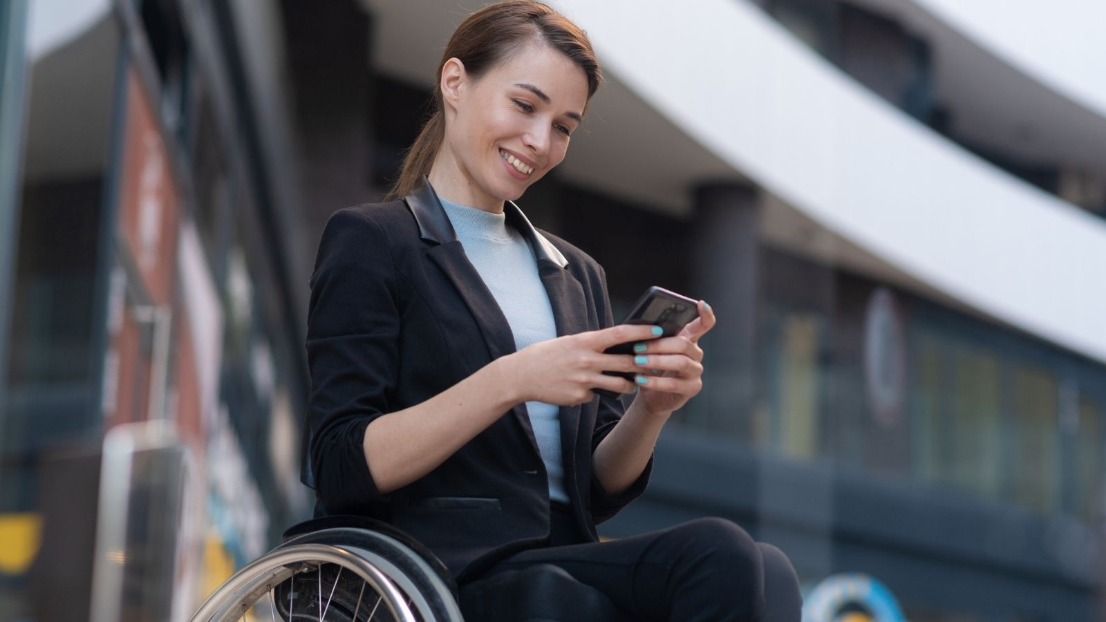 woman in a wheelchair on the phone