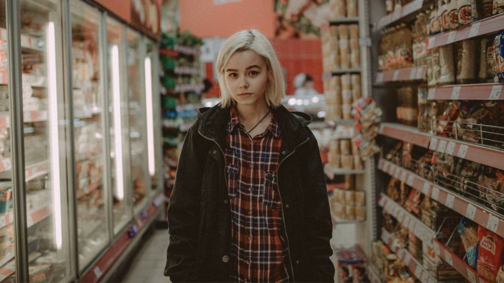 woman walking through convenience store