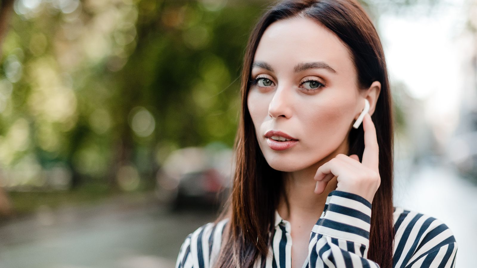 woman with air pods in ear