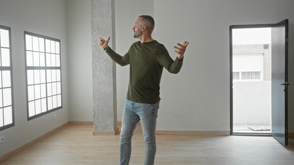 young man in empty new condo