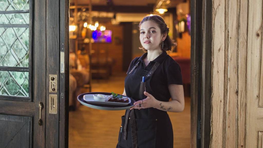 young waitress holding a platter