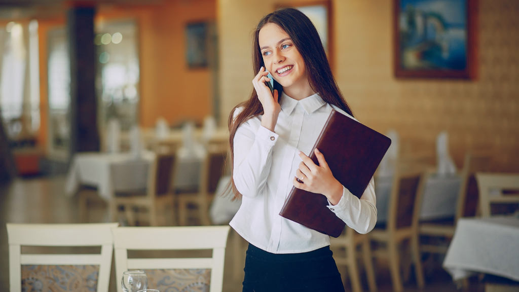 young woman fancy restaurant on the phone