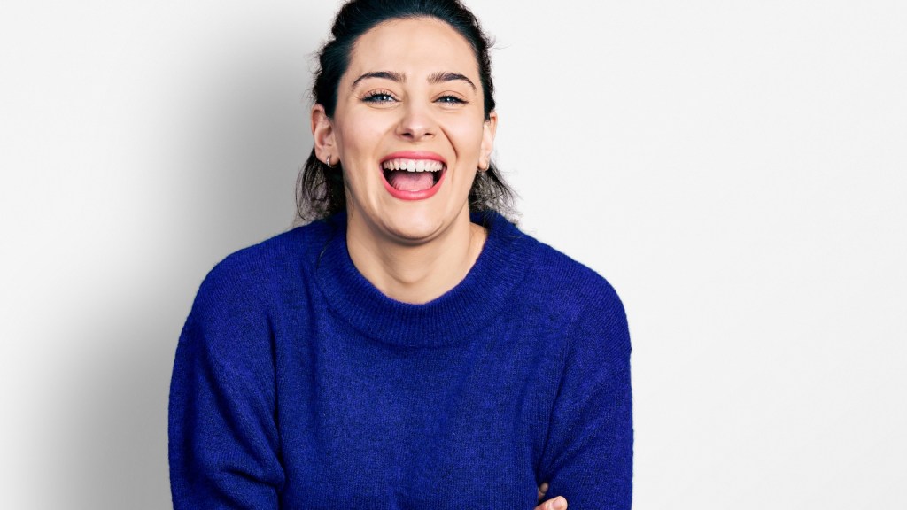 young woman laughing hysterically