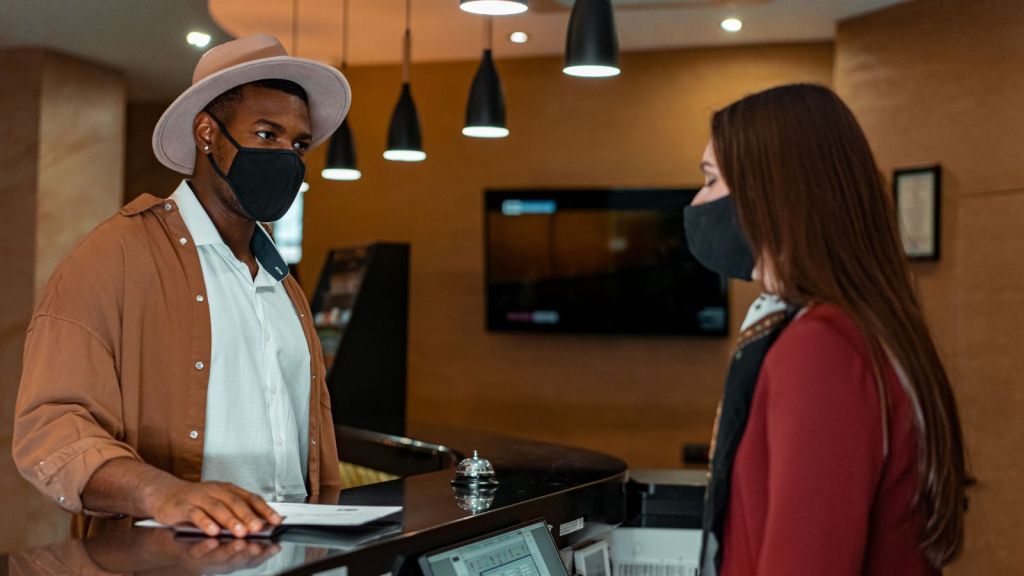 Man and woman at hotel reception