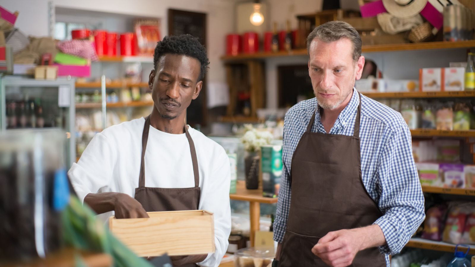 He Was Denied a $40/Week Raise After Saving the Company $120,000—Then Realized His Valued Employee Status Was a Management Lie Two men working in a retail store