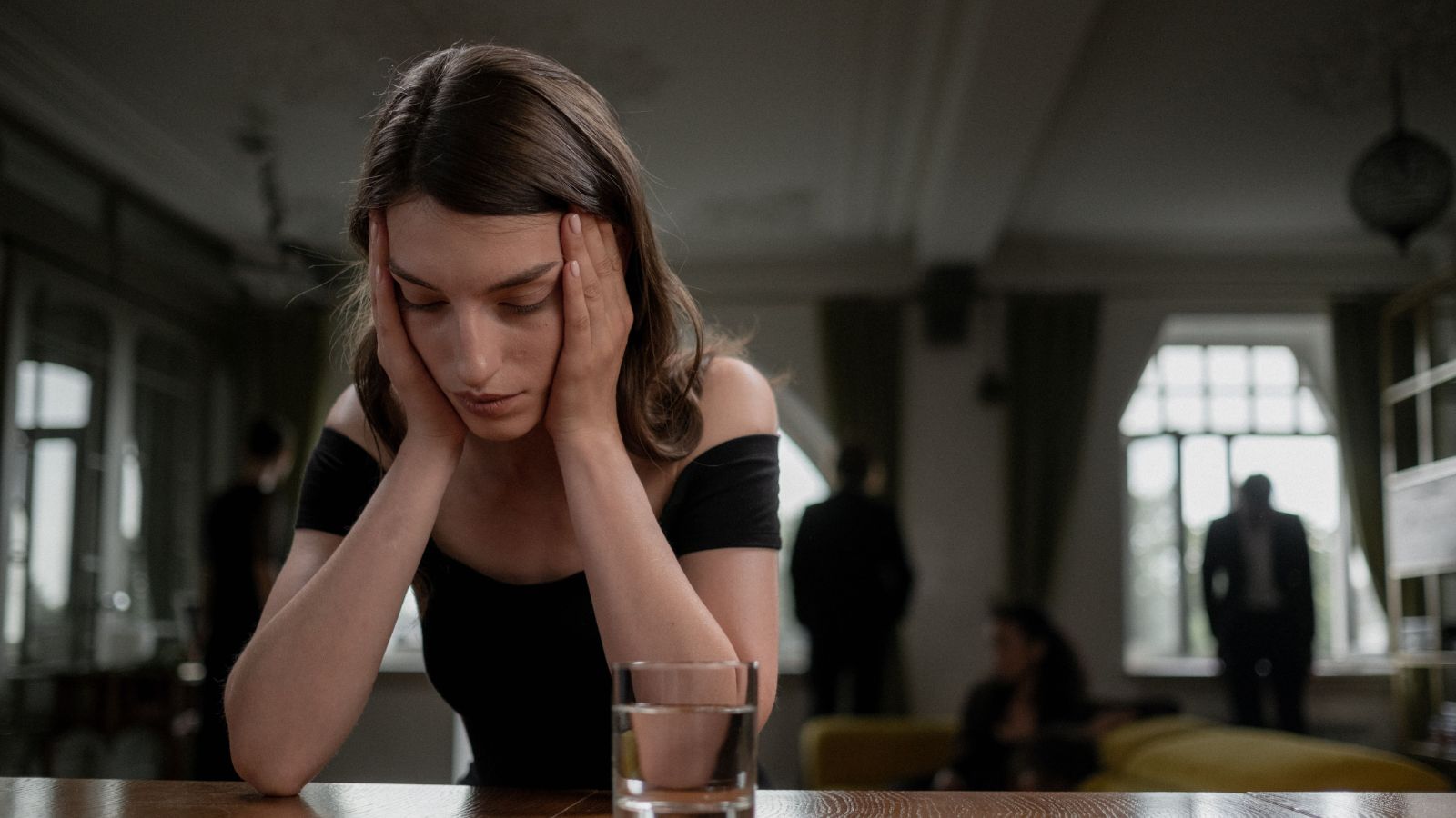 Her Mother and Brother Cornered Her to Demand Her Inheritance Shares—Then Excluded Her After She Refused to Sign Their Family Business Agreement Sad woman in a black dress