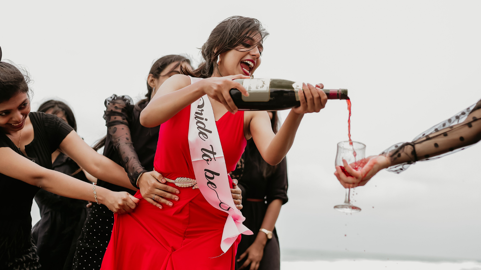 She Unveiled a $45,000 Secret Debt at Her Bachelorette Party—Then Asked Her Maid of Honor to Help Hide It from the Groom A bride to be pouring red wine