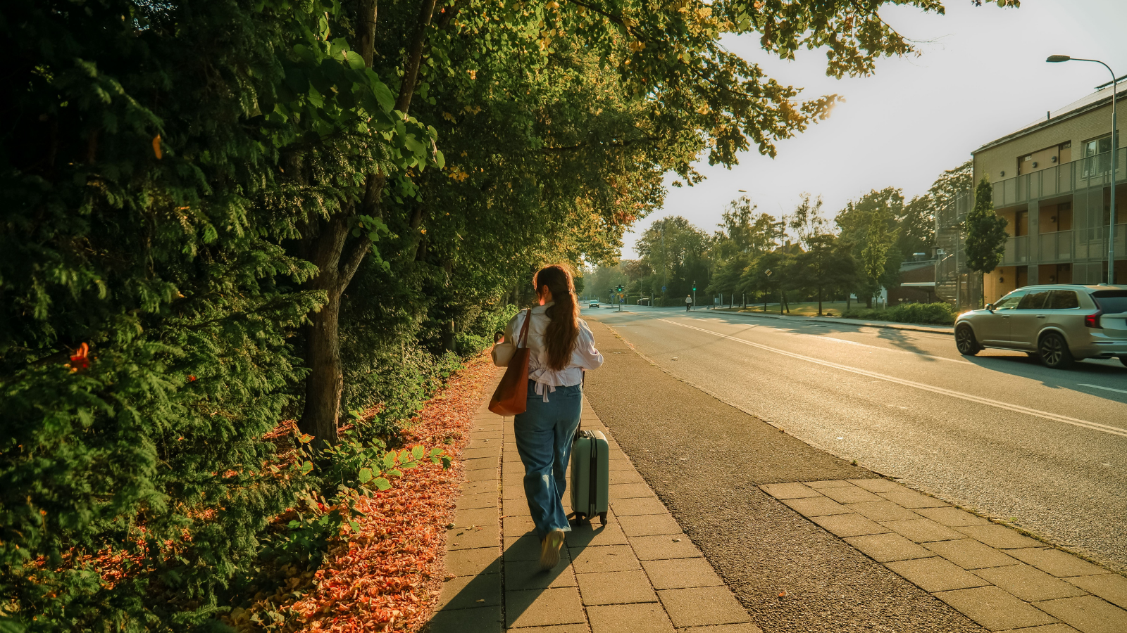 Man Was Looking Forward To His Friends Visit, But Her Increasingly Insulting Remarks Made Him End The Trip Early A woman walking away with a suitcase