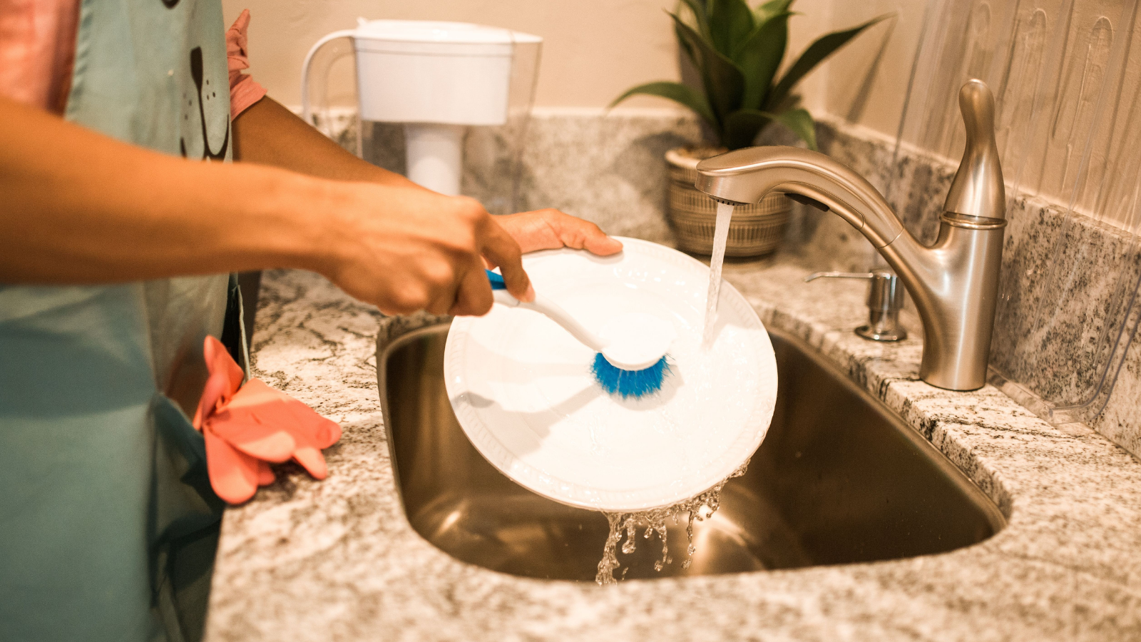A person washing dishes