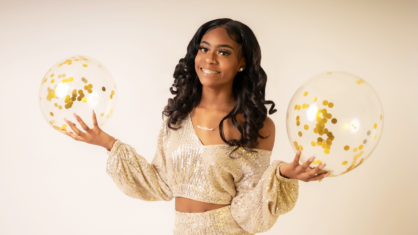 A girl with birthday balloons