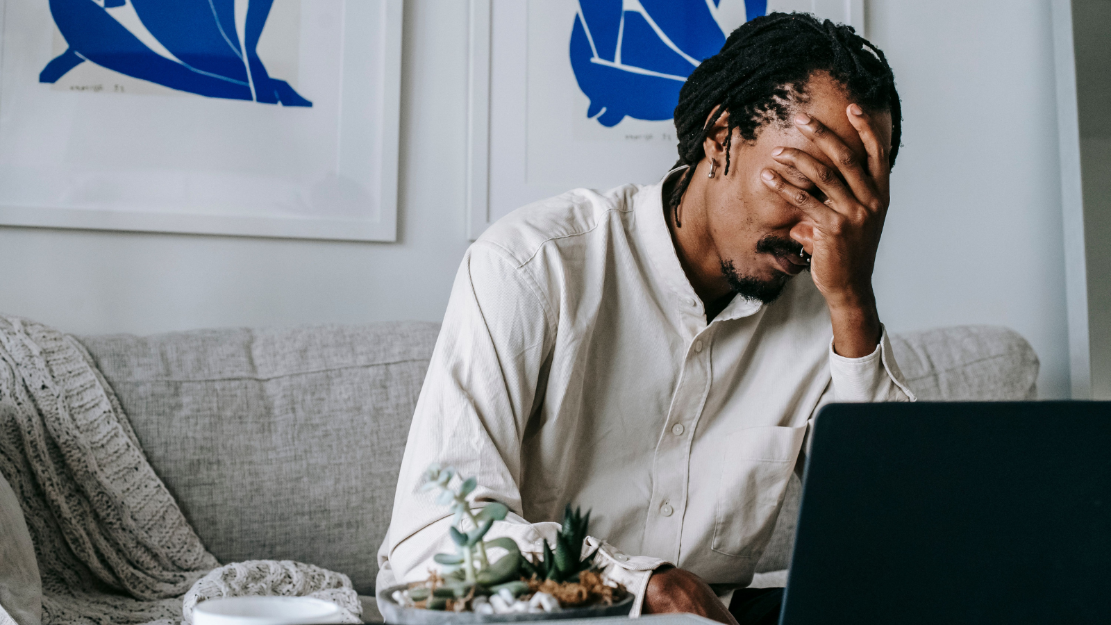 He Dismissed Months of Workplace Harassment as Harmless Office Banter—Until HR Issued a Final Warning and Demoted Him A man working with his hand over his eyes