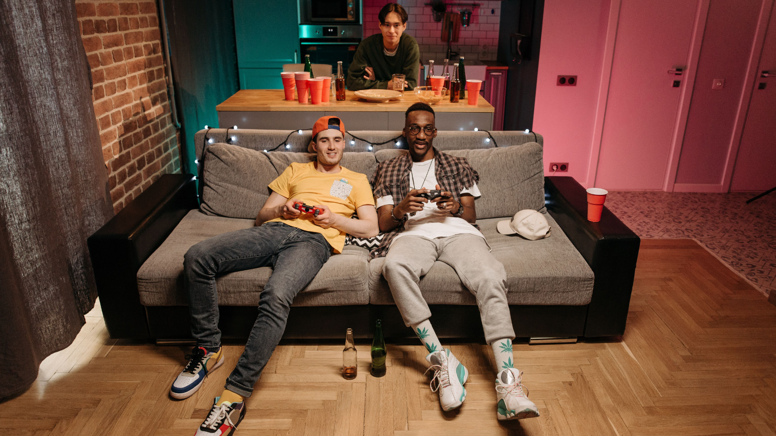 Gaming Buddies Have Always Played Together In The Evenings, But Now Adulthood Has Hit And Their Time Together Is Getting Sparse And Its Causing Bad Feelings To Simmer Amongst The Group Three guys playing video games