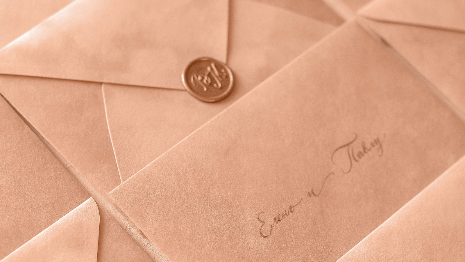 They Cut Their Wedding Guest List to Stay Under Budget—Then Excluded Relatives Demanded They Host a $10,000 Family Reception to Make Up for It Wedding invitations with a wax seal