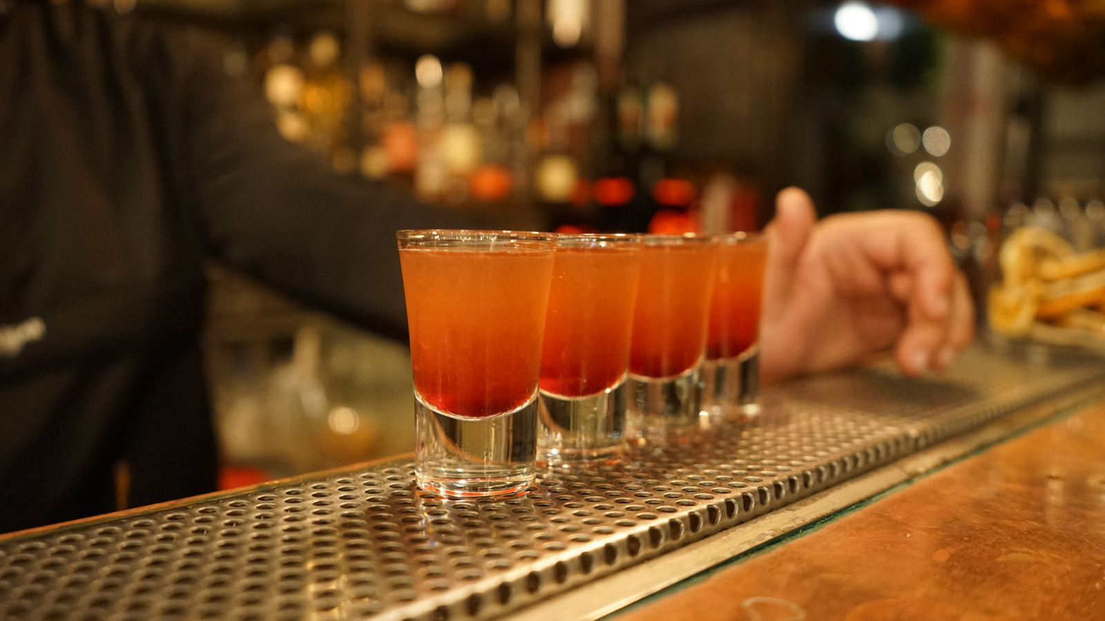 Woman Stopped Drinking So She Could Watch Her Roommate, But Eventually Even She Couldnt Handle Her Behavior A row of shots on a bar