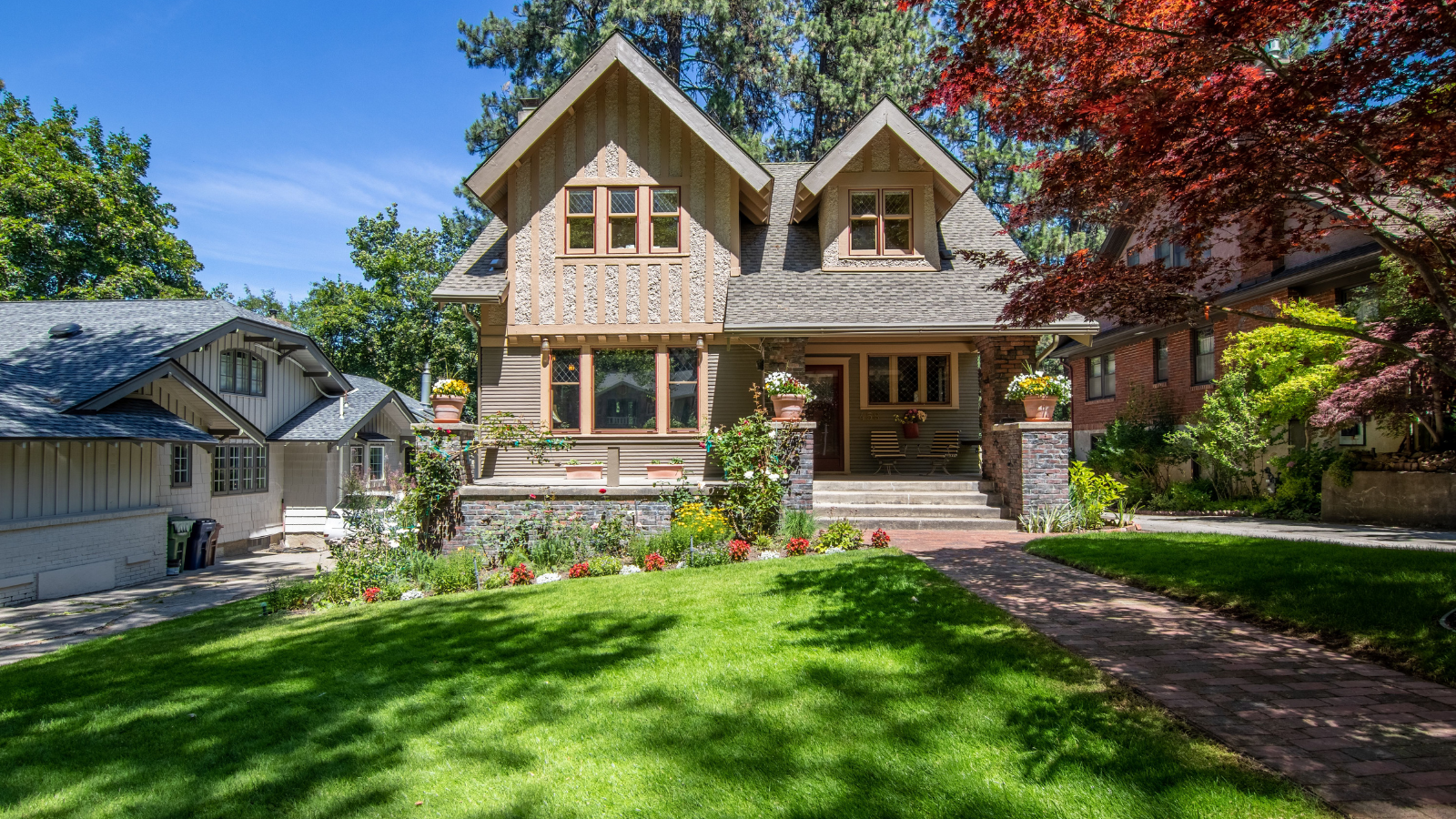 A house with a large front lawn