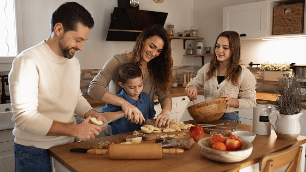 Vacationing Man Expected A Quiet And Intimate Getaway With His Partner, But Unexpected Family Drama Quickly Changed The Entire Trip Family preparing food at home