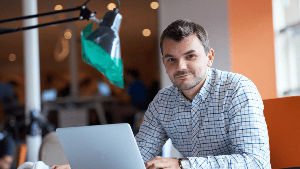 IT guy sitting at his desk