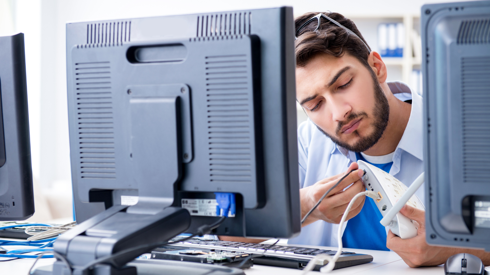They Fired Their Senior Administrator — Then Watched Their Systems Crash Without Him IT guy working on router at computer