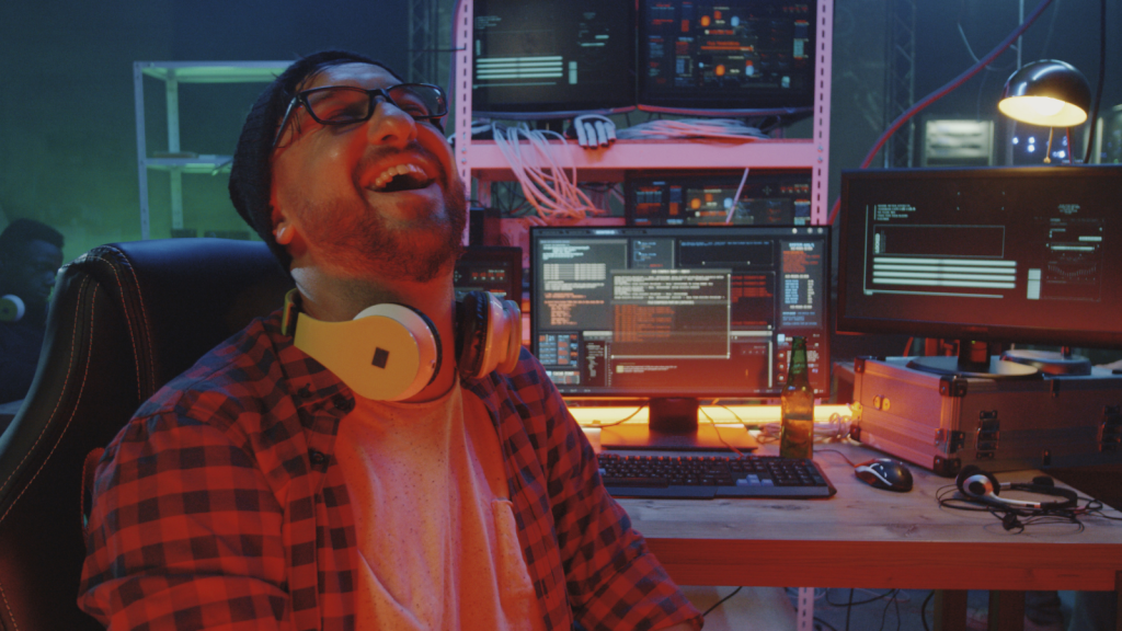 He Followed Company Policy To The Letter, Yet Nearly Got Fired For It — Until He Pulled Out Proof IT worker laughing to himself around computers