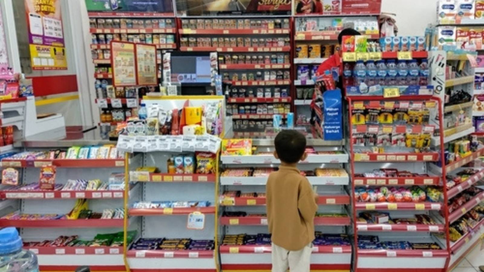 Kid at a checkout counter
