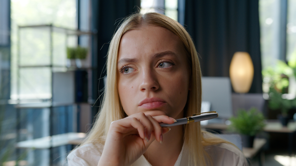 A Young Woman Dropped the Nice Act and Called Out Her Father at Her Own Milestone Event—After His Selfish Behavior Finally Crossed the Line Pensive frustrated young woman thinking with pen in hand
