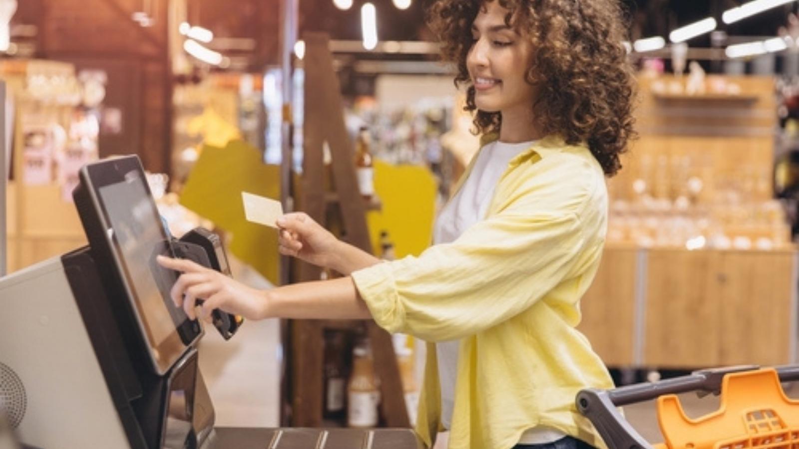 Woman at self-checkout