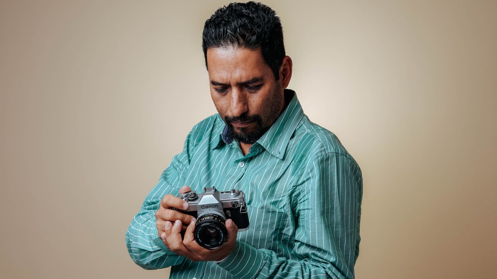 Man trying to read port name on his camera